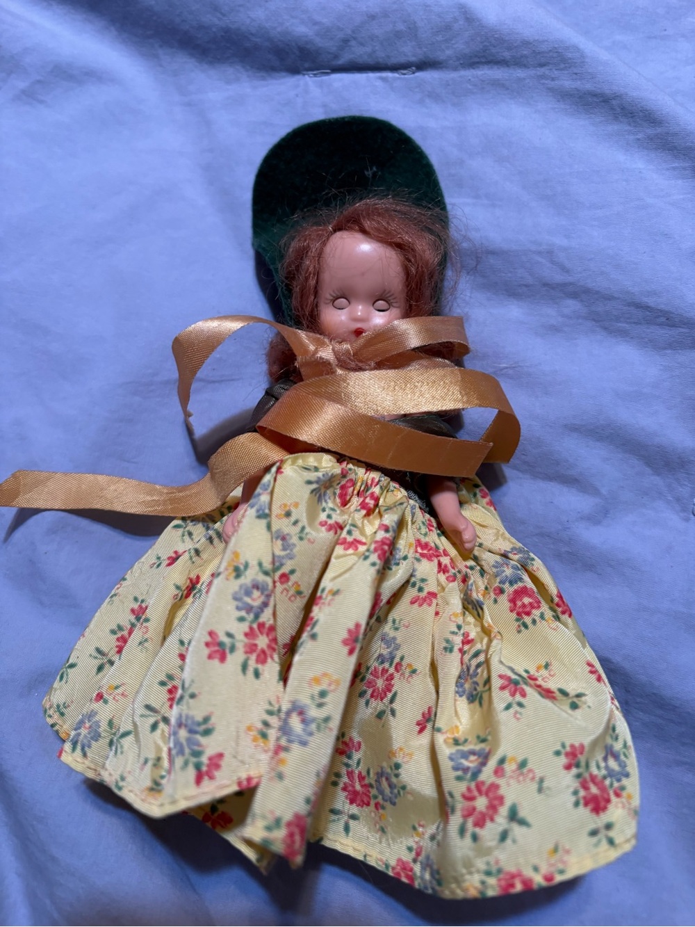 Vintage-Inspired Yellow Floral Doll with Ribbon Accent